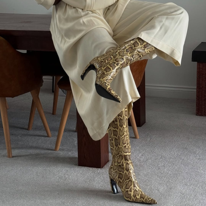 @nlmarilyn wears snake print boots cream trousers