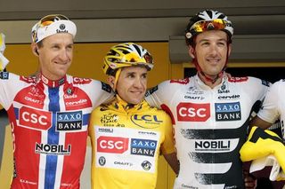 Carlos Sastre is flanked by Norwegian champion Kurt-Asle Arvesen and Fabian Cancellara as CSC-Saxo Bank are presented as best team.