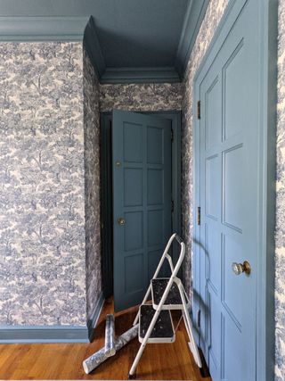 Blue wallpapered children's bedroom