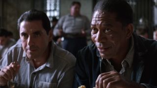 Morgan Freeman listens happily with a fellow prisoner at lunch in The Shawshank Redemption.