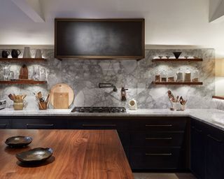 Modern kitchen with stone backsplash and LED light shelves