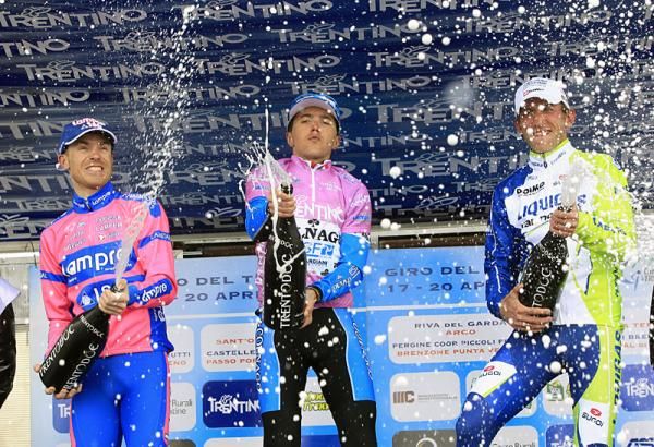 The top three finishers at the Giro del Trentino let loose with the bubbly on the podium.