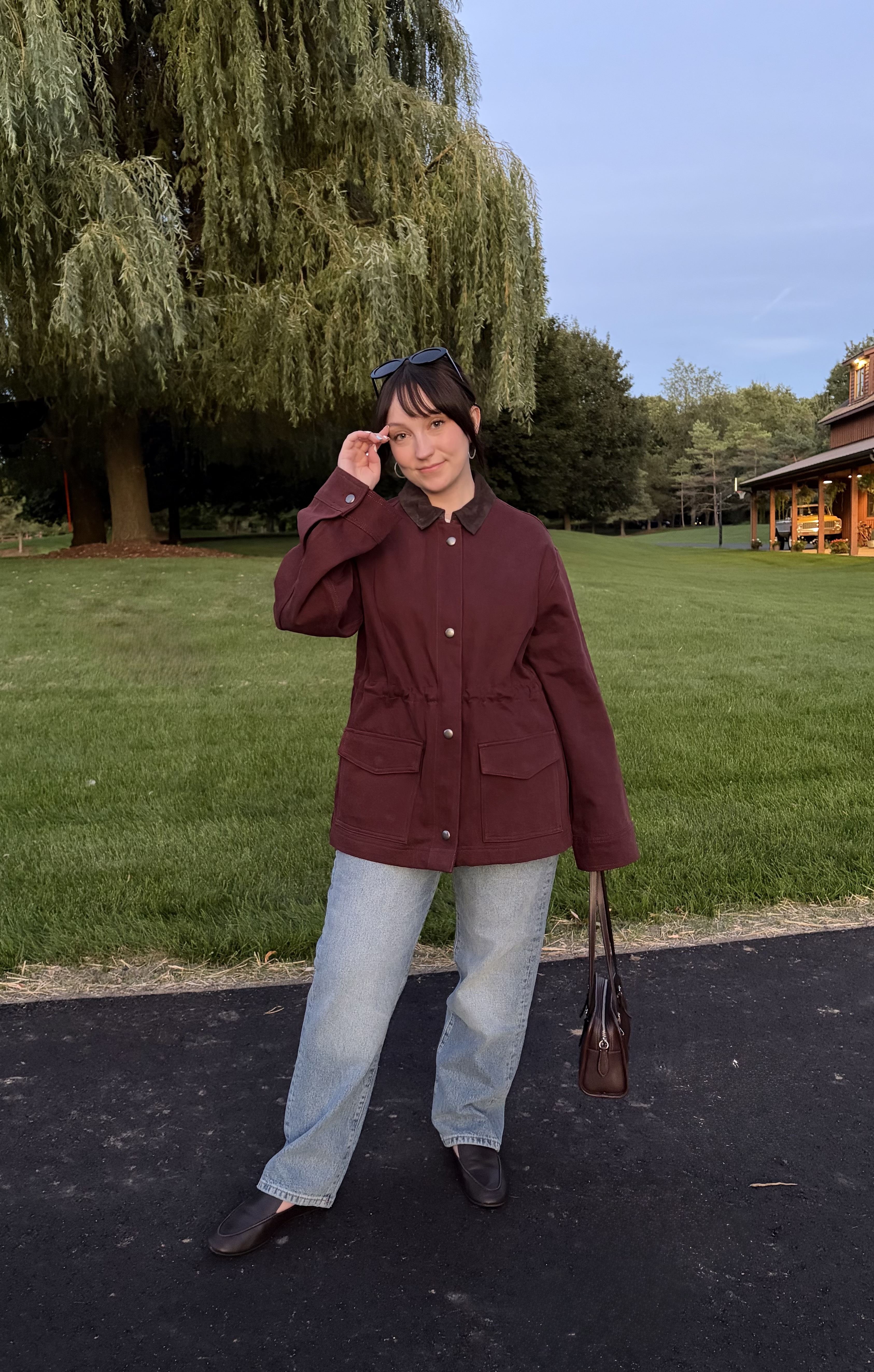 Meguire Hennes styled the burgundy barn jacket and light-wash jeans from the DL1961 and Moda Operandi collaboration with Princess Olympia of Greece