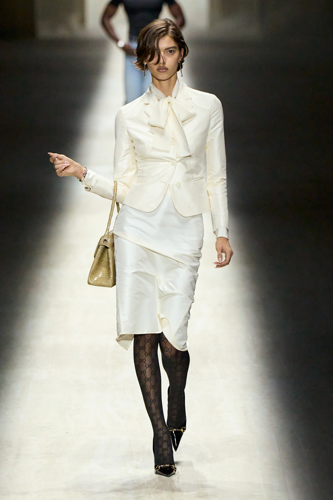 a model walks the Gucci fall/winter 2026 runway show during Milan Fashion Week