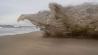 A sandstorm with huge clouds shaped like horses