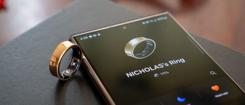 The gold Samsung Galaxy Ring alongside the Samsung Wearables app