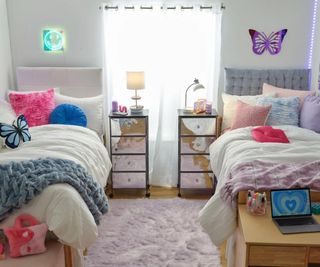 a y2k styled dorm room with two beds and colorful accents