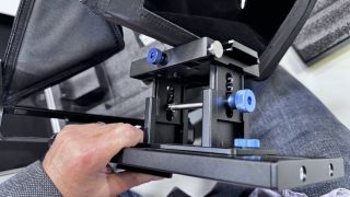 Camera adjustment mechanism on the Neewer Teleprompter X14 III held in a hand