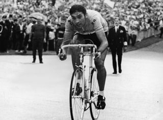Belgian cyclist Eddy Merckx arrives at Vincennes in the final stage of the Tour de France as spectators cheer him on, Vincennes, France, mid 1969. This would be the first of five victories for Merckx at the Tour de France. (Photo by Agence France Presse/Getty Images)