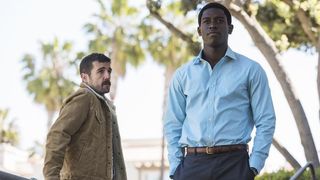 Carter Hudson as Teddy McDonald and Damson Idris as Franklin Saint standing in front of palm trees in Snowfall