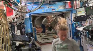 ISS Crew Members Dock Japanese Cargo Vehicle