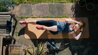 Woman performs bicycle crunch exercise