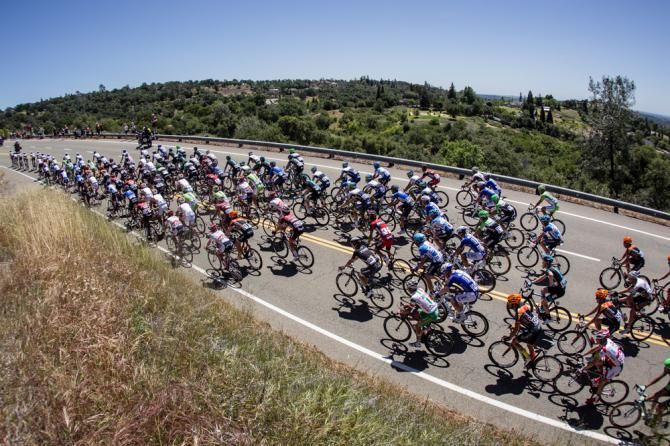 The peloton gets up one of todays longer climbs
