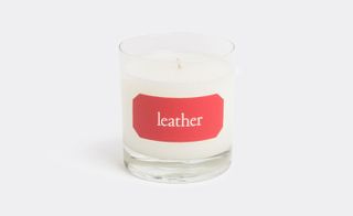 Candle with "Leather" label on