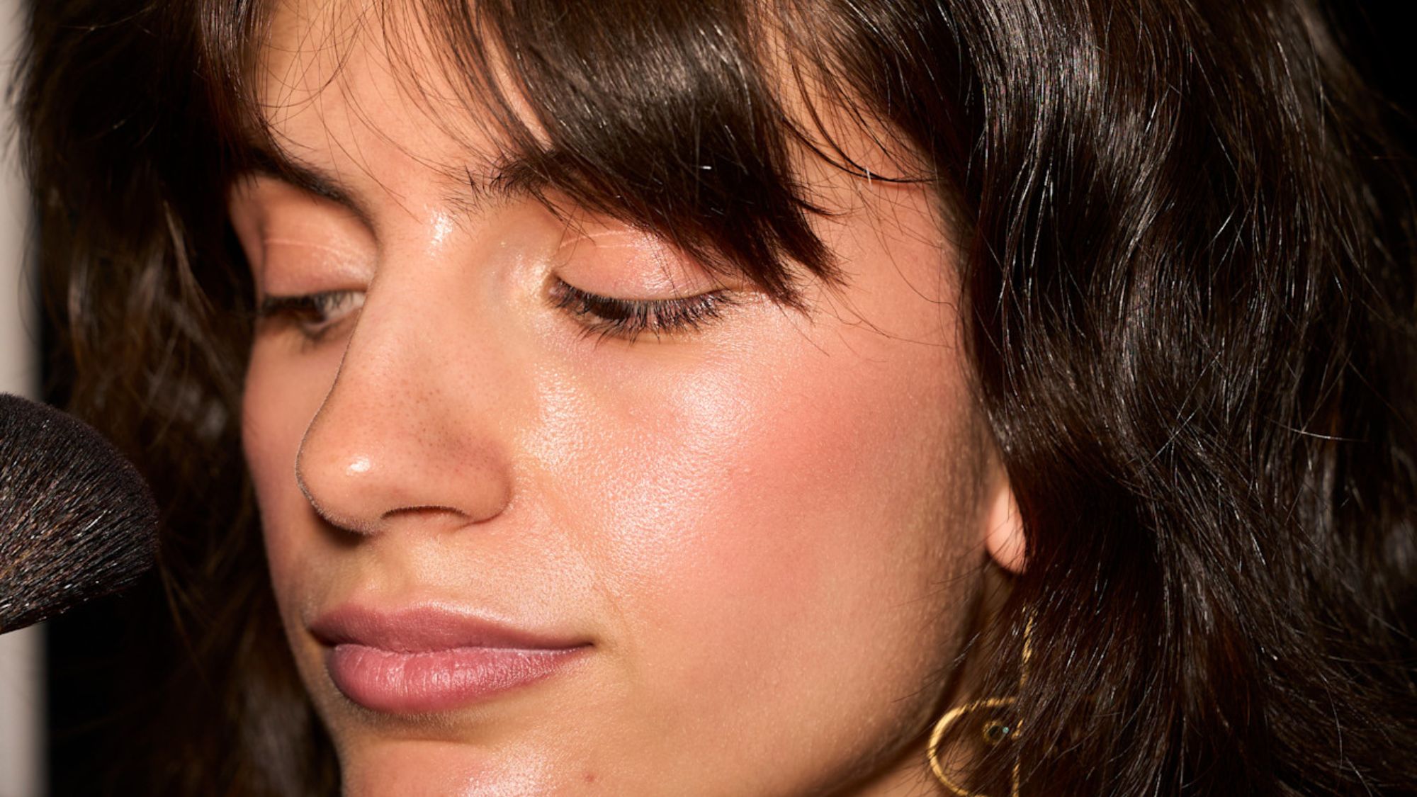 model backstage with tanned skin