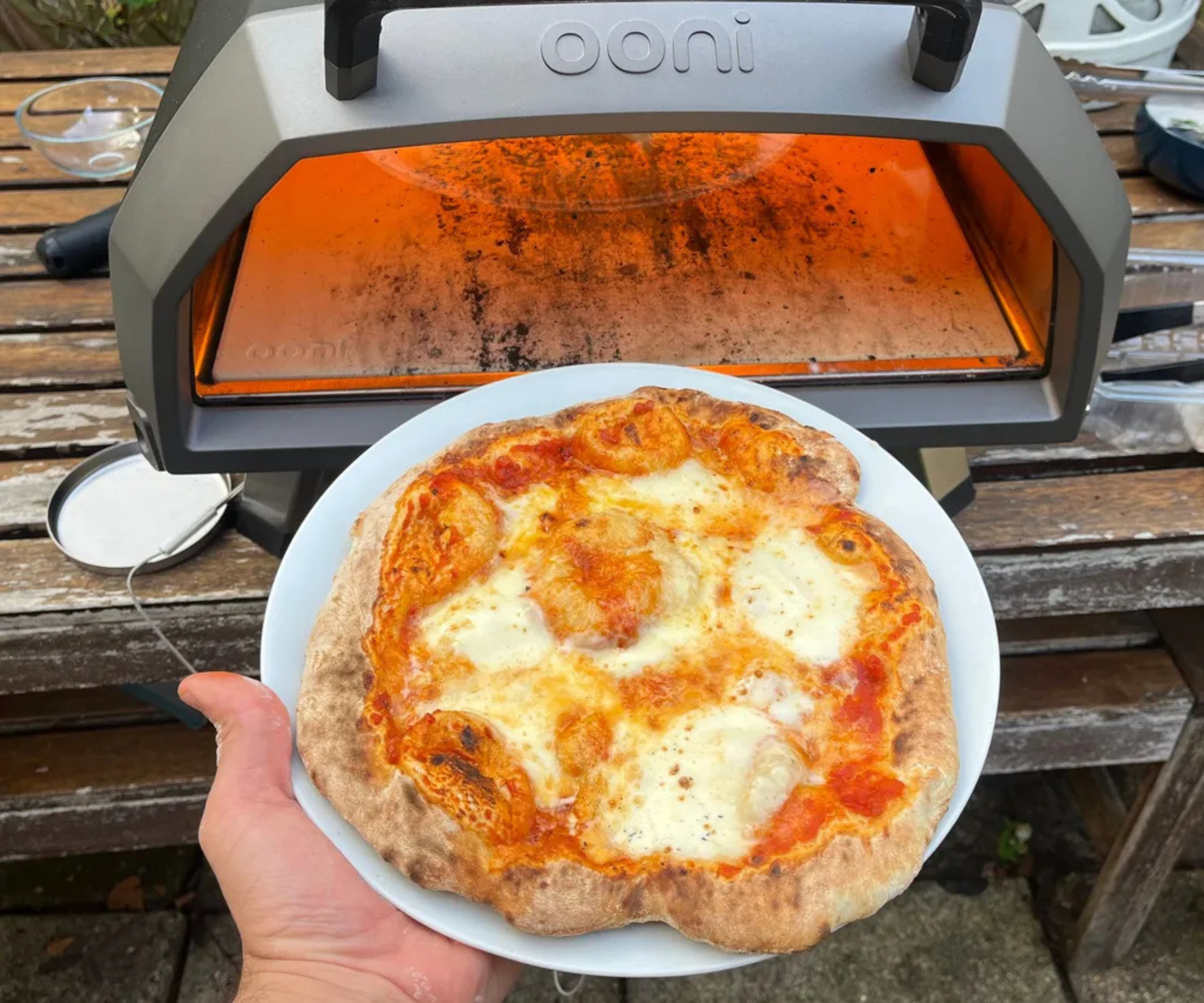 A finished cheese pizza baked in the Ooni Karu 2 Pro 