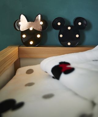 bedroom with mickey and minnie frame and blue wall
