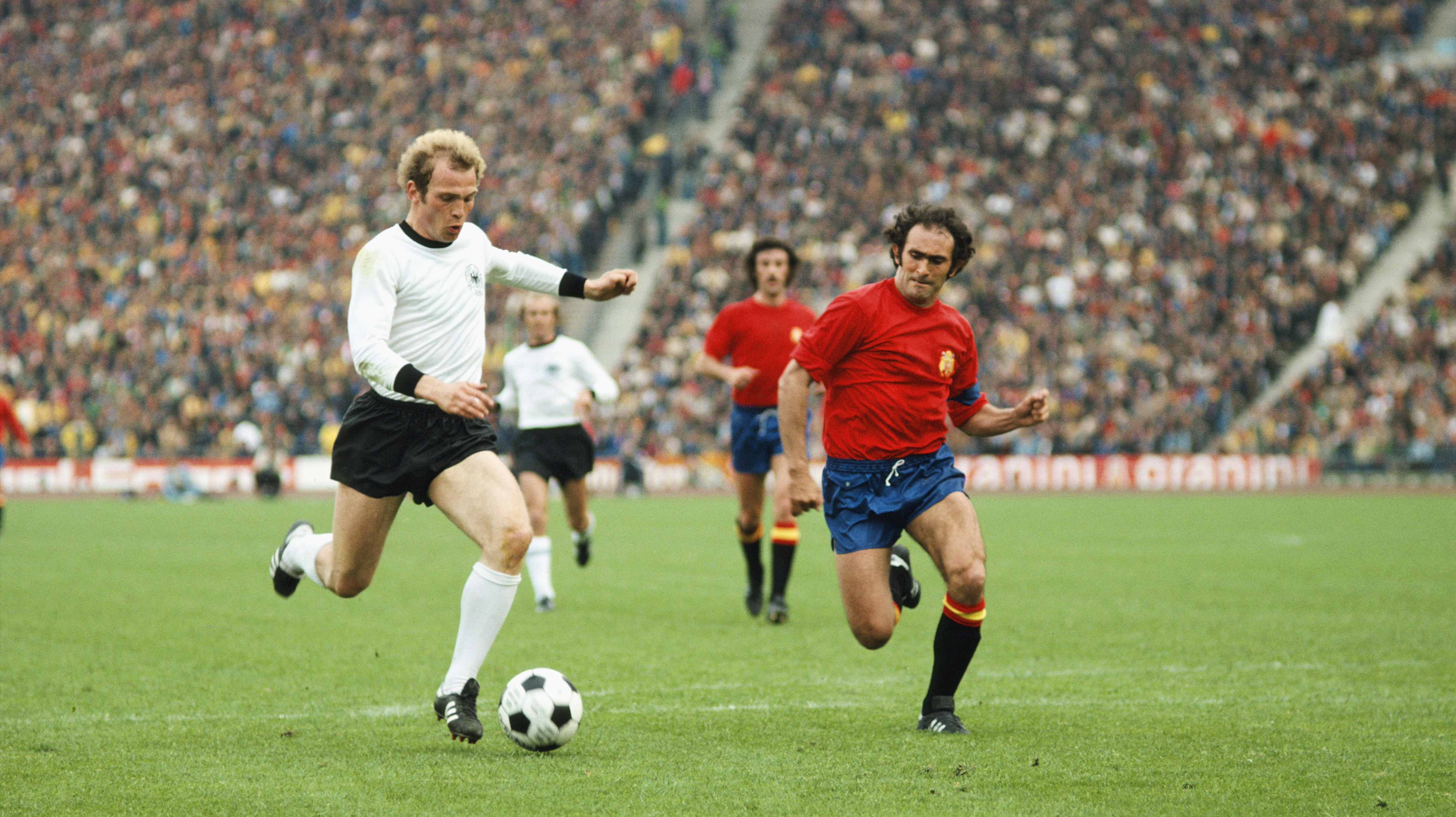 West Germany's Uli Hoeness and Spain's Pirri compete for the ball in 1976.