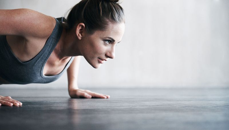 A woman doing press-ups