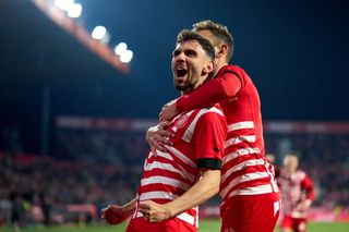 Ivan Martin of Girona FC celebrates with his teammate Cristhian Stuani after scoring their team's fifth goal during the LaLiga Santander match between Girona FC and UD Almeria at Montilivi Stadium on February 17, 2023 in Girona, Spain.