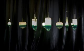 Chandelier of floating glass buoys in green and wihite
