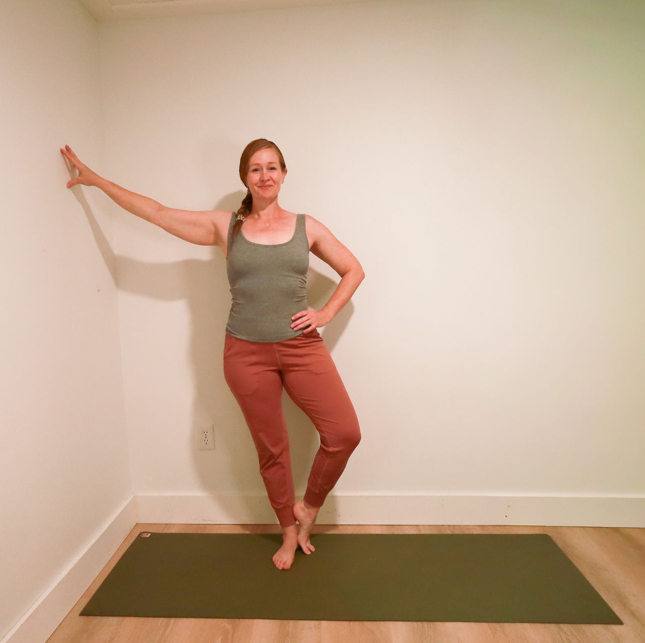 Woman demonstrates yoga pose