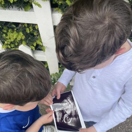Ernest and August Brooksbank holding an ultrasound