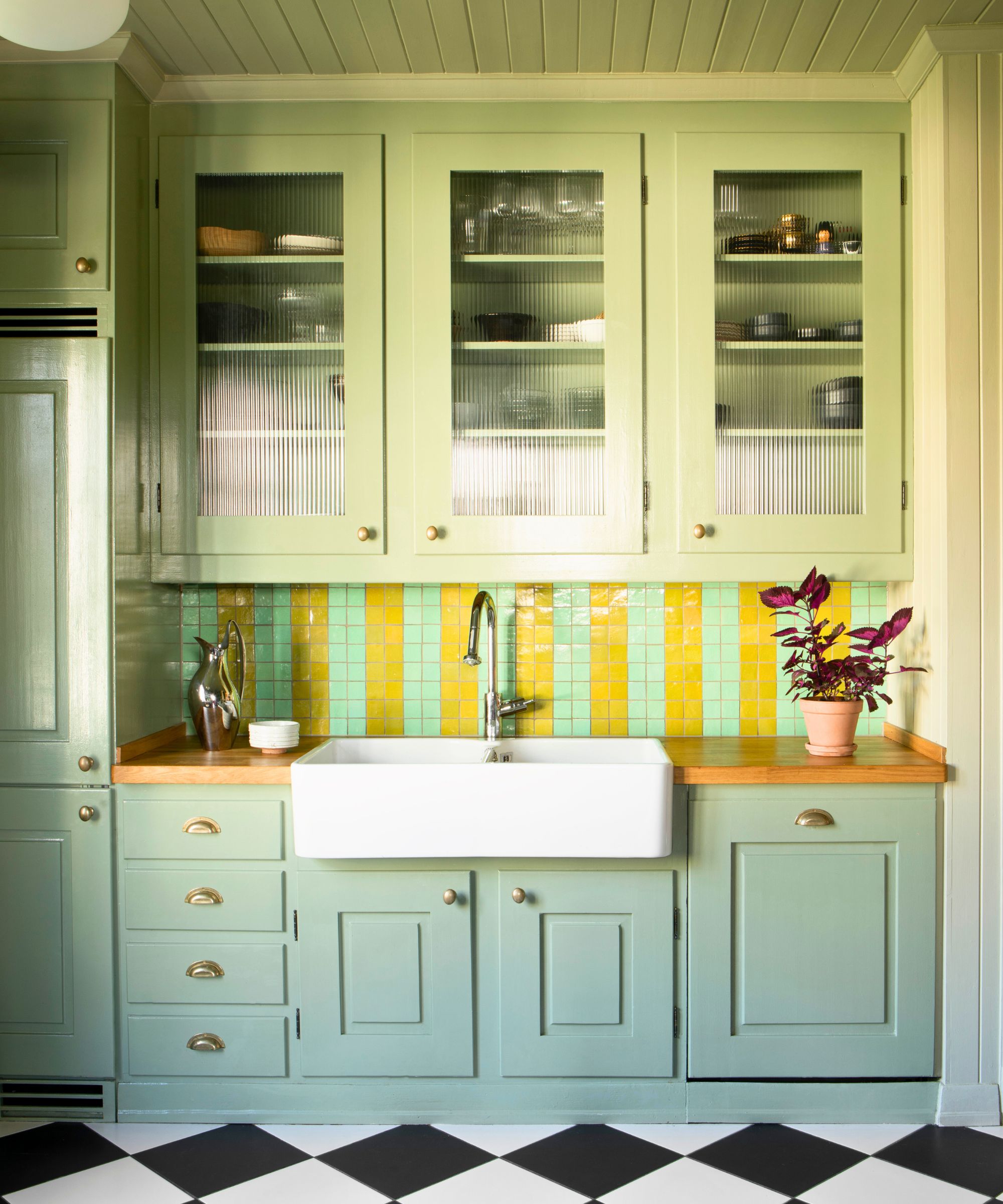 green kitchen cabinets colorful tiles