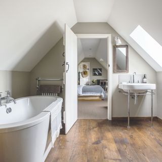 White master bedroom en suite with bath looking into the bedroom