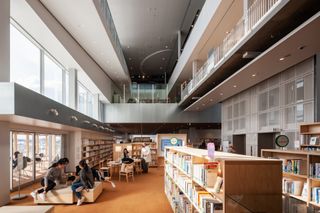 Sukagawa Community Center and its library and reading rooms with double height ceilings and timber interior