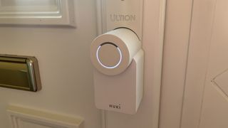 Ultion Nuki smart lock installed on a front door