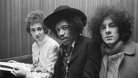  Jimi Hendrix seated in centre with, on left, drummer Mitch Mitchell and, on right, bassist Noel Redding of the Jimi Hendrix Experience in London, circa August 1967