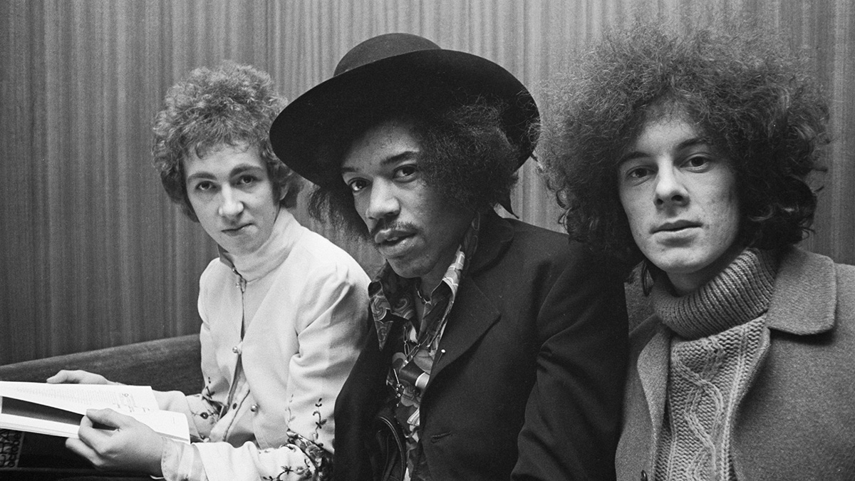  Jimi Hendrix seated in centre with, on left, drummer Mitch Mitchell and, on right, bassist Noel Redding of the Jimi Hendrix Experience in London, circa August 1967