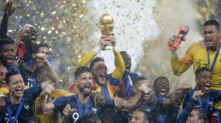 France's players celebrate with the World Cup trophy after beating Croatia in the final of the FIFA World Cup 2018 on 15 July, 2018 at the Luzhniki Stadium in Moscow, Russia.