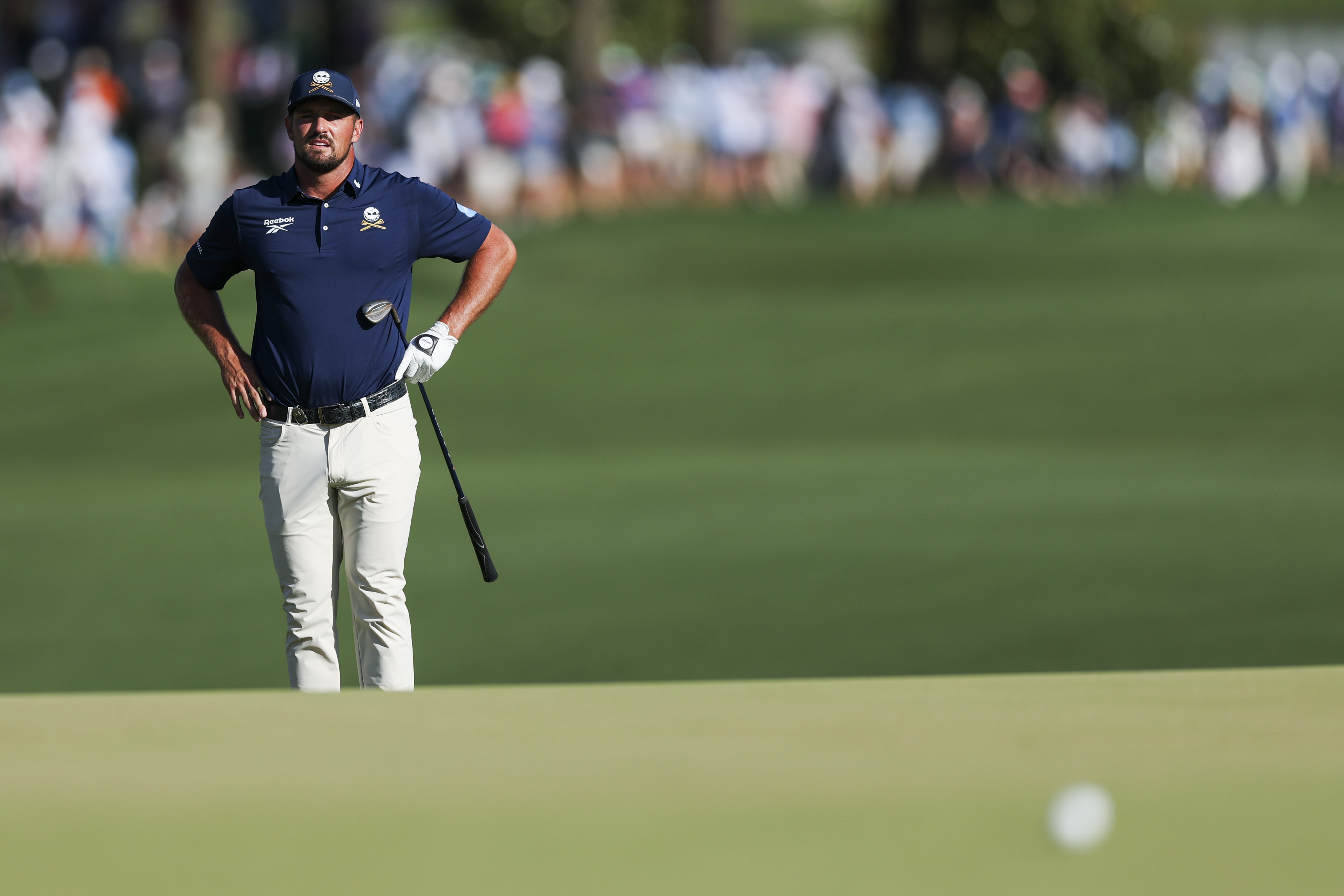 Bryson DeChambeau hits a putt
