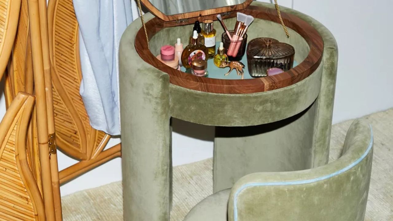 green velvet vanity dressing table with a small matching chair