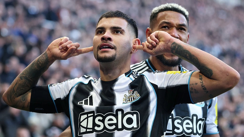 Bruno Guimaraes, of Newcastle, puts his fingers. in his ears to celebrate scoring the winning goal against Fulham in the 2025/26 Premier League match
