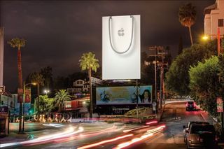 Apple Christmas billboard advert, a giant Apple bag with the Apple logo wrapped in a bow