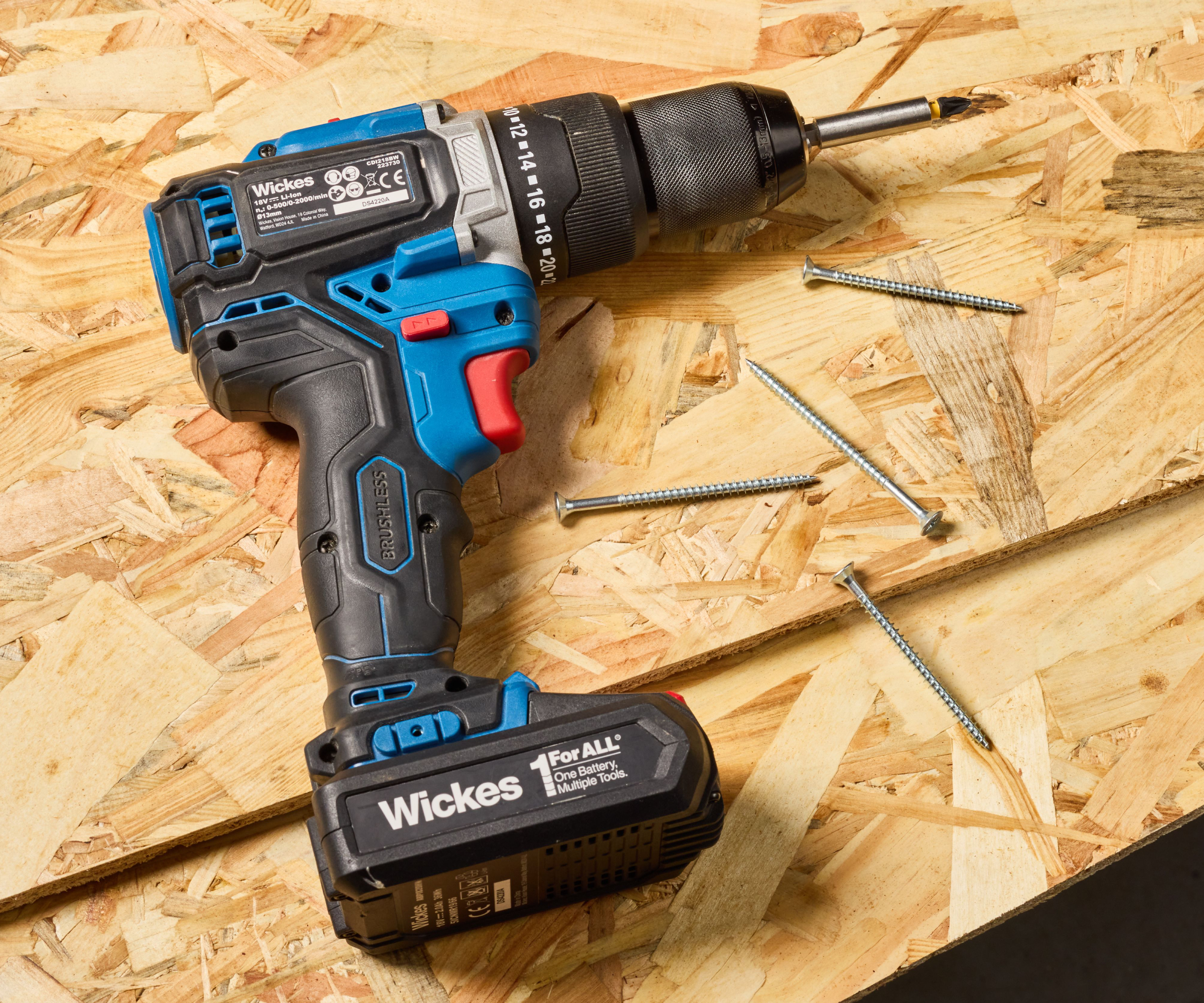 drill and screws resting on sheets of OSB