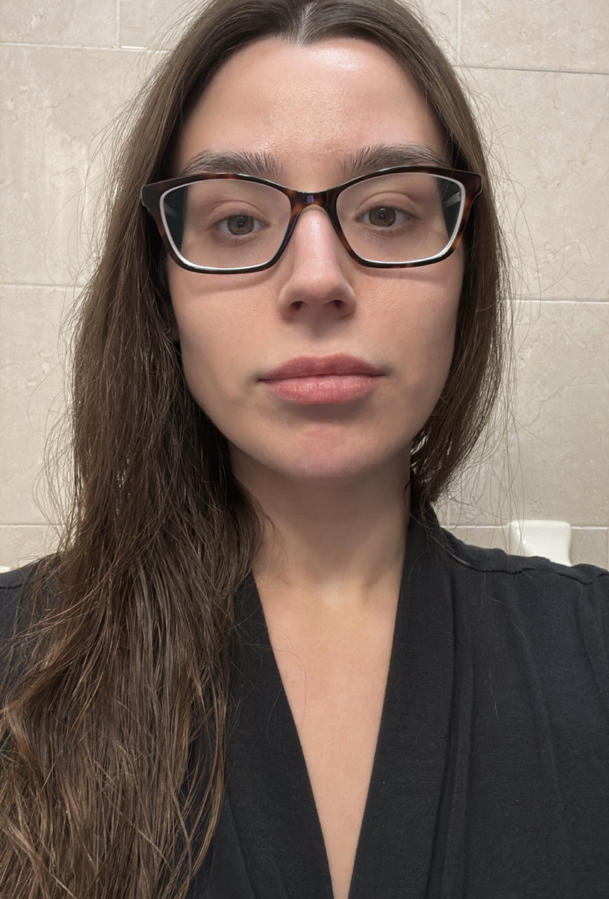 Siena Gagliano with bare skin and glasses