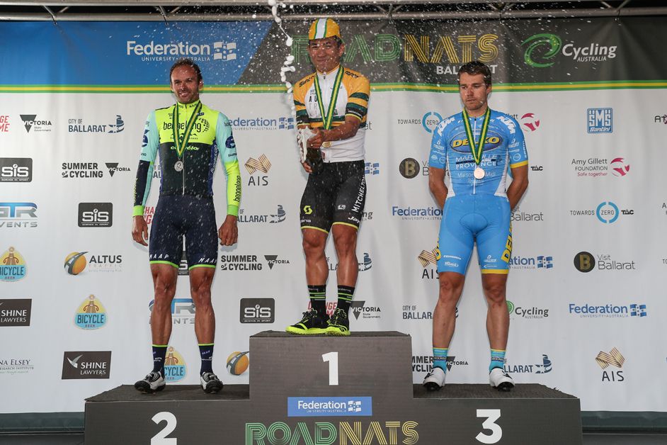 Ewan sprays the champagne on the podium