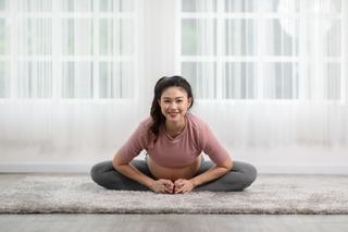 Postpartum exercise: A woman stretching