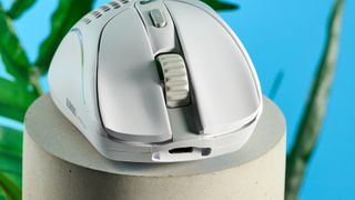 A white Glorious Model D2 wireless gaming mouse with a perforated design