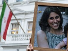A photo of Nazanin Zaghari-Ratcliffe, held by one of her supporters