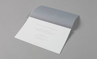 A white wax paper layer was printed with transparent type. When pressed against an accompanying piece of grey wax paper