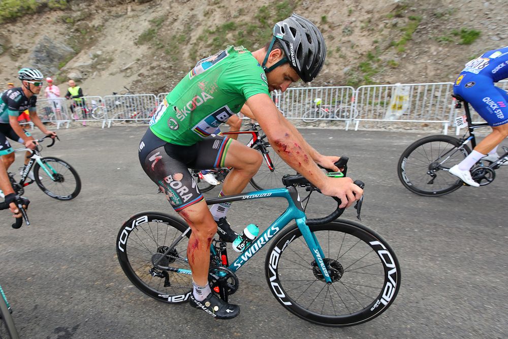 Peter Sagan checks himself for damage following his stage 17 crash at the Tour de France