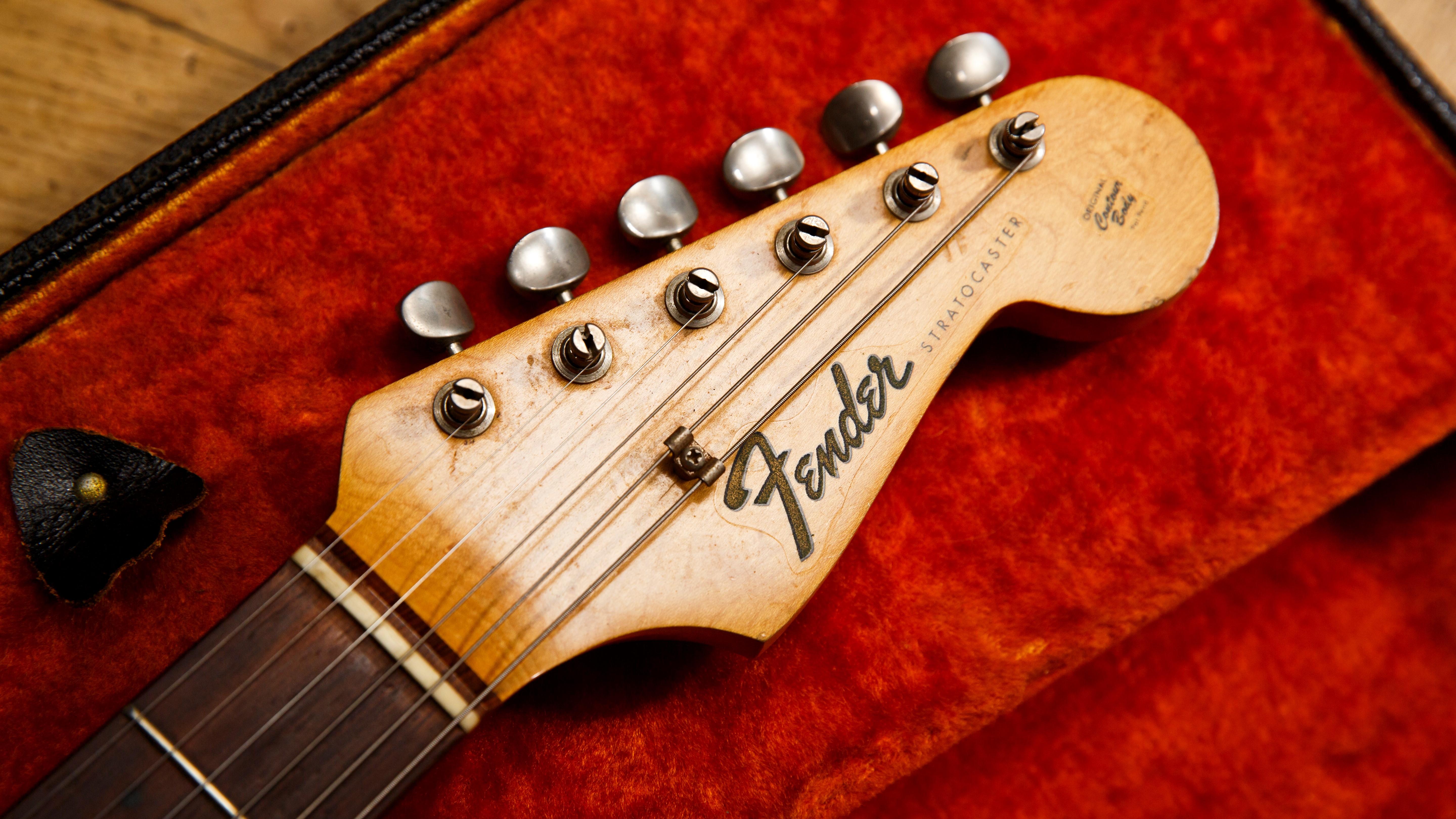 Vintage Fender stratocaster headstock on top of a hardcase