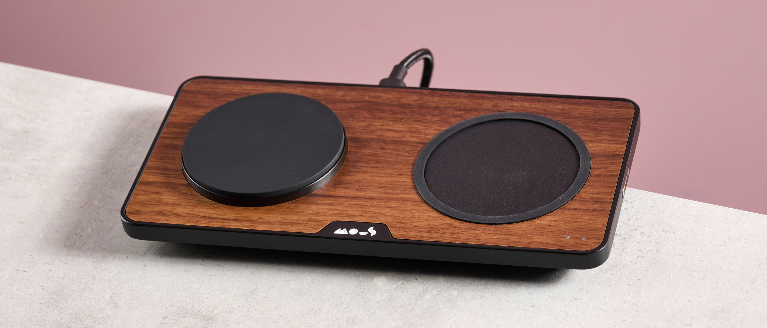 The Mous Charging Station with Qi2 sits at a slight angle on a light grey surface.