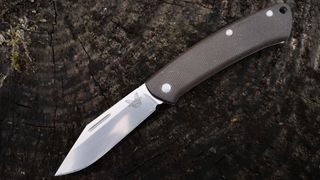 Benchmade Proper 318 Clip-point Micarta camping knife unfolded on log