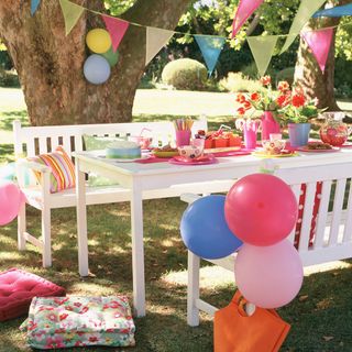 garden decorated with balloons and bunting